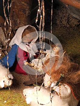 Hand crafted traditional Christmas decoration showing the holy family and sheep