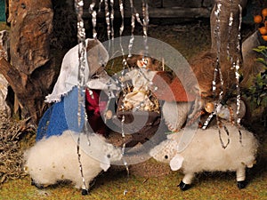 Hand crafted traditional Christmas decoration showing the holy family and sheep