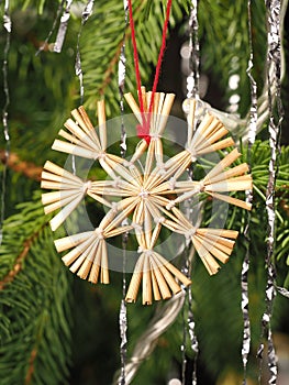 Hand crafted traditional Christmas tree decoration star made of reed