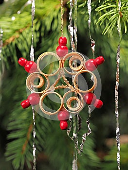 Hand crafted traditional Christmas tree decoration star made of wood