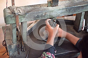 Hand of craftsman holds several stone cutters