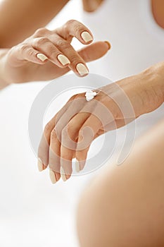 Hand Cream. Close Up Of Woman's Hands Applying Lotion On Skin