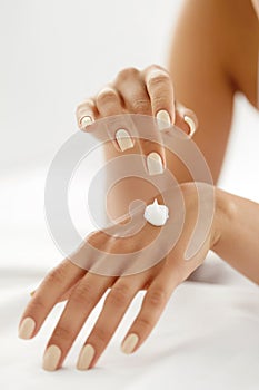 Hand Cream. Close Up Of Woman's Hands Applying Lotion On Skin