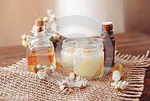 Hand cream and lip balm in a glass jar. Natural organic cosmetics with honey, wax and oils