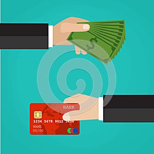 Hand with credit card and hand with cash.