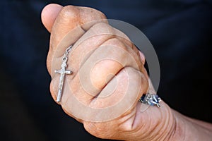 Hand with a cross