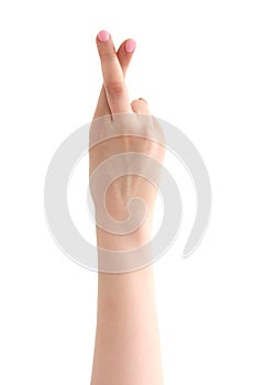 Hand with crossed fingers on white background