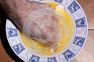 Hand Crushing Egg Yolk