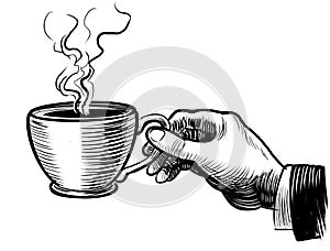 Hand with a cup of tea