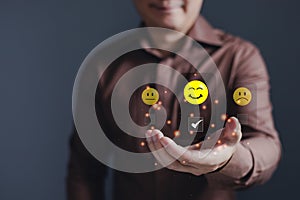 hand of customer or client holding smile face to complete five stars with copy space.Service rating,giving a five star rating.