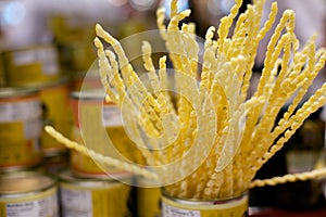 Hand Cut Pasta Bundle Standing Upright in Tin Can with Shallow DOF