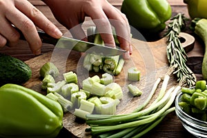 Hand cutting fresh celeries