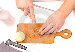 Hand cutting onions