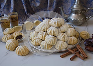 Hand decorated `Maamoul` an Arab dessert filled cookies, made with dates paste, almonds, walnuts and cinnamon