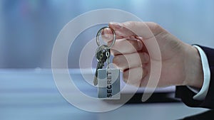 Hand demonstrating keychain, conspiracy, providing data protection, secret