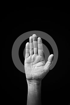 Hand demonstrating the Ukrainian sign language letter `Ð’`