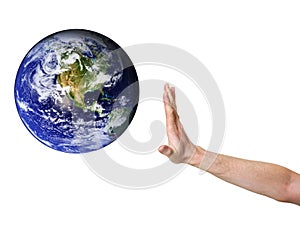 Hand denying entrance for planet earth