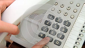 Hand dialing phone with number pad