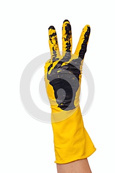 Hand in dirty yellow glove