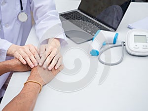 Hand of doctor giving comfort to senior woman, woman and medicine professional in a hospital, healthcare, health and life