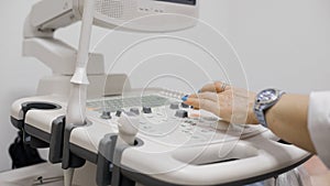 Hand of a doctor operating the ECHO