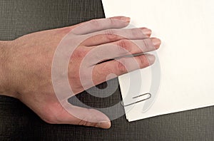 Hand on document