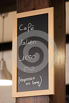 Hand drawing coffee price on blackboard