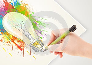 Hand drawing colorful idea light bulb with a pen