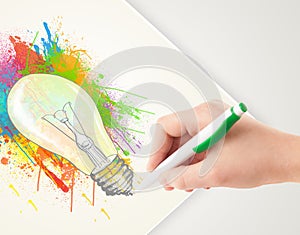 Hand drawing colorful idea light bulb with a pen