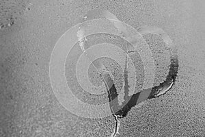 Hand drawing heart on the wet window glass