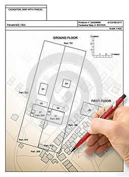 Hand drawing an imaginary cadastral map of territory with buildings and roads