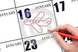 A hand drawing outline of airplane on calendar date 16 January. The date of flight on plane.