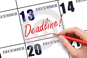 Hand drawing red line and writing the text Deadline on calendar date December 13. Deadline word written on calendar