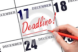 Hand drawing red line and writing the text Deadline on calendar date December 17. Deadline word written on calendar