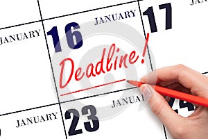 Hand drawing red line and writing the text Deadline on calendar date January 16. Deadline word written on calendar