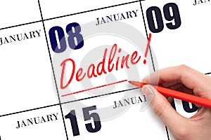 Hand drawing red line and writing the text Deadline on calendar date January 8. Deadline word written on calendar