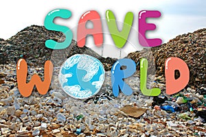 Hand drawing Save the World on garbage dump in landfill background. Environmental conservation and saving the earth concept