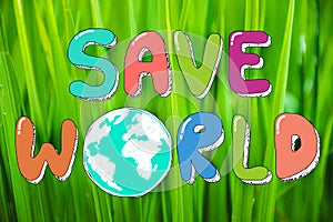Hand drawing Save the World on green nature background in Happy earth day. Environmental conservation and saving the earth concept