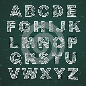 Hand-drawn alphabet. Calligraphy font. Modern chalk lettering. Letters on the green board