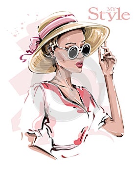 Hand drawn beautiful young woman in hat. Stylish girl in sunglasses. Fashion woman look. Sketch.