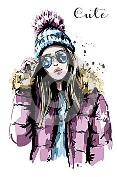 Hand drawn beautiful young woman in knit hat. Fashion woman in sunglasses. Stylish girl.