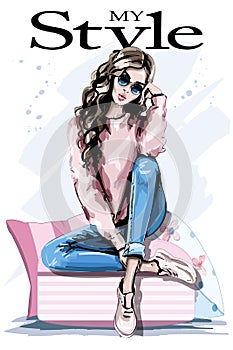 Hand drawn beautiful young woman sitting on soft pillows. Fashion woman in sunglasses. Stylish outfit.