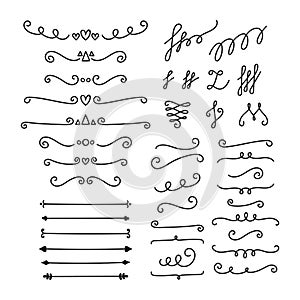 Hand drawn calligraphic design elements. Set of decorative symbols in doodle style. Lines, borders and dividers