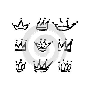 Hand drawn crown icon set in black color. Ink brush crowns background.