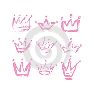 Hand drawn crown icon set in pink color. Ink brush crowns background for baby Princess.