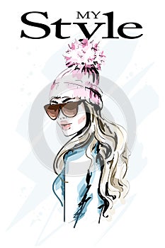 Hand drawn fashion woman in knitted hat with fur pompom. Stylish beautiful young woman portrait. Cute girl in winter clothes.