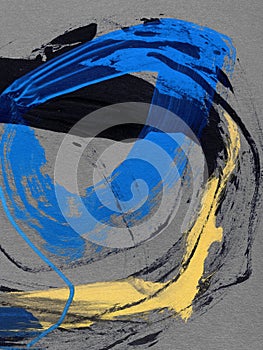 Hand-drawn frame abstract circles on canvas. paint black and blue strokes on background. photo