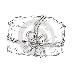 Hand drawn gift illustration. paper wrapped package tied with cord or twine. Vintage engraved gift box icon. present or