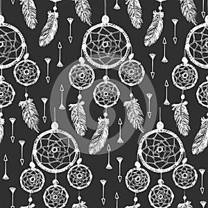 Hand-drawn with ink dreamcatcher with feathers, arrows. Seamless pattern.