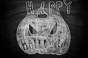 Hand Drawn Jack O Lantern Chalk Illustration on Blackboard. Happy Halloween Lettering Text. Greeting Card photo
